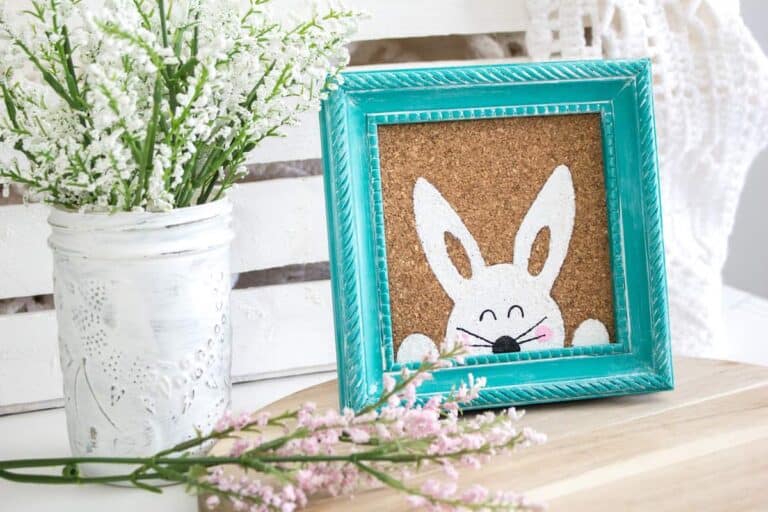 Stenciled Easter Bunny Art on table with vase of flowers