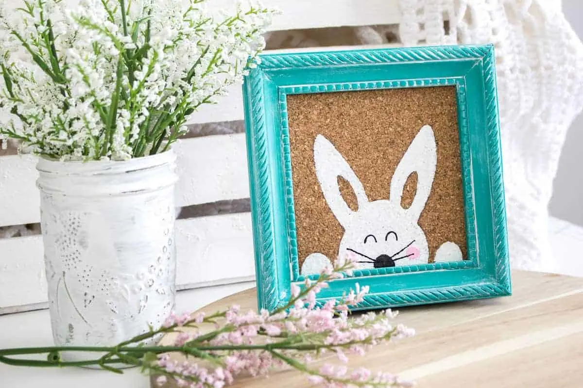 Stenciled Easter Bunny Art on table with vase of flowers