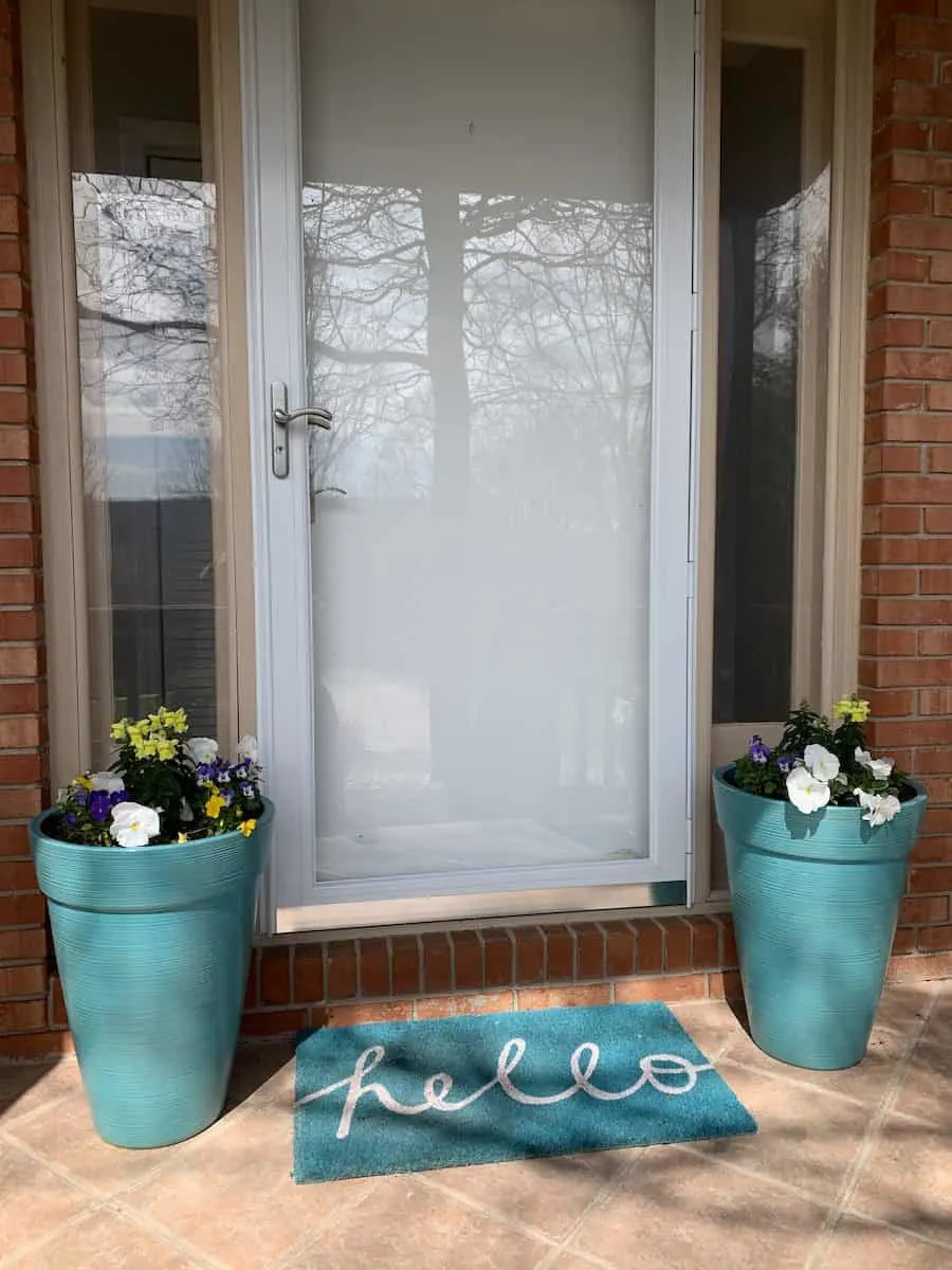 https://singlegirlsdiy.com/wp-content/uploads/2021/03/large-blue-flower-pots-by-front-door.jpg.webp