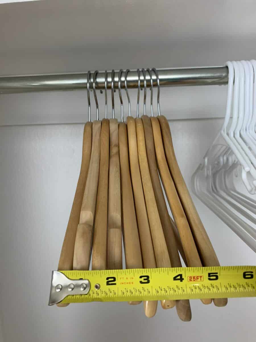 https://singlegirlsdiy.com/wp-content/uploads/2021/07/Wooden-hangers-in-closet-900x1200.jpeg