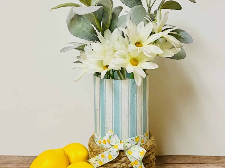 decoupaged paper napkin glass vase with lemons on wood table
