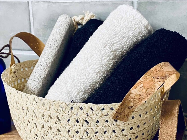 straw hat wicker basket stuffed with washcloths