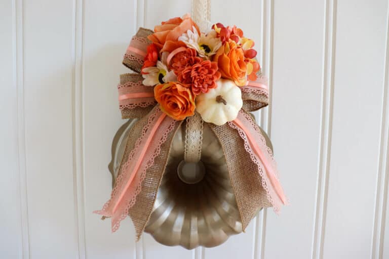 pumpkin wreath with flowers made out of a bundt pan