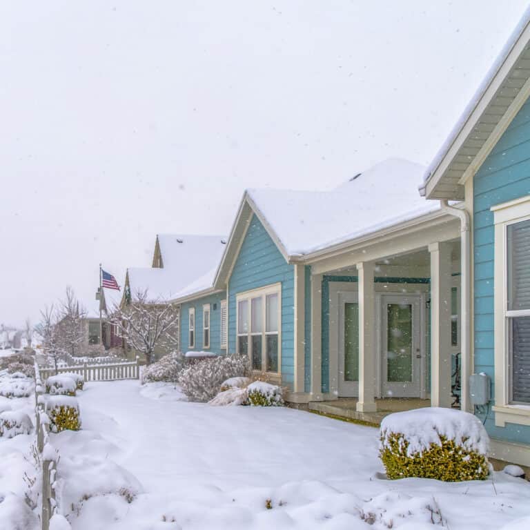 row of houses covered in snow