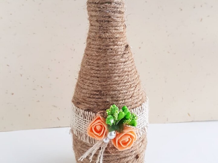 decorated glass bottle with twine