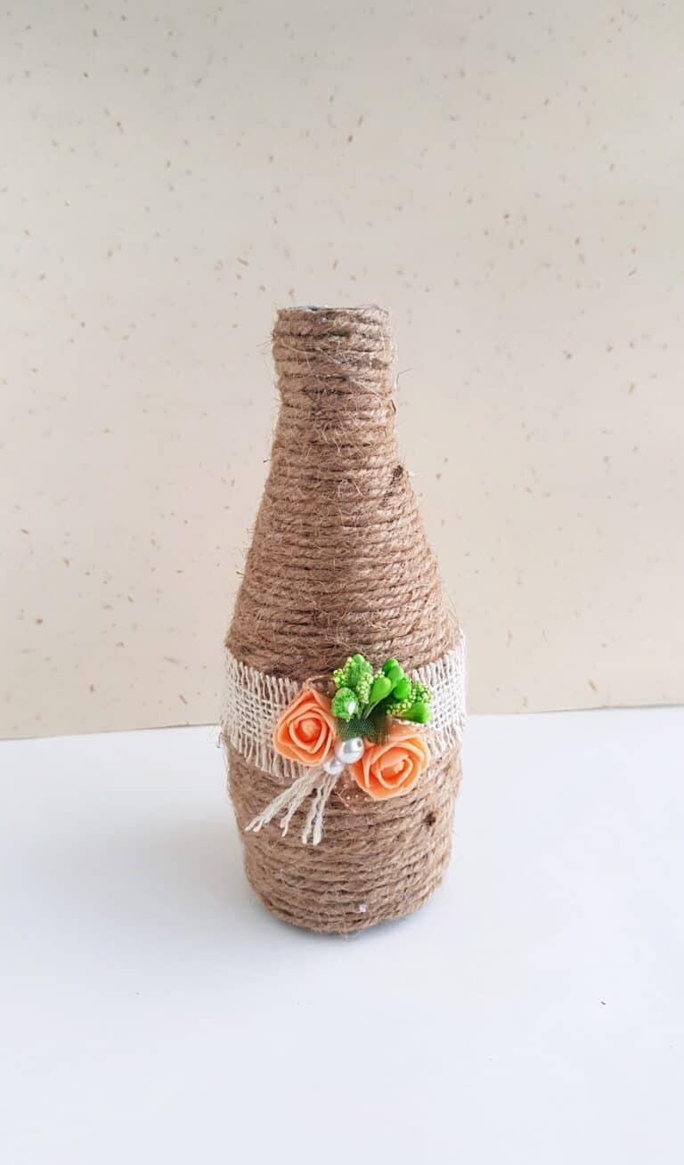 decorated glass bottle with twine