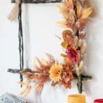 homemade farmhouse wreath with fall floral swag
