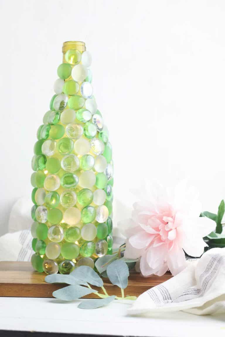 beaded glass bottle used as a vase