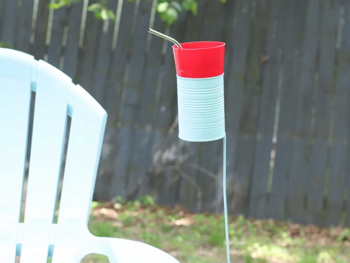 tin can drink holder by outdoor chair