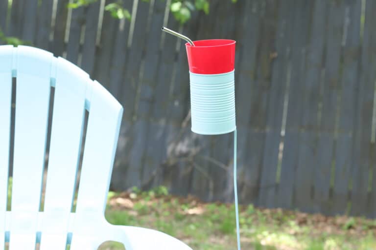 tin can drink holder by outdoor chair