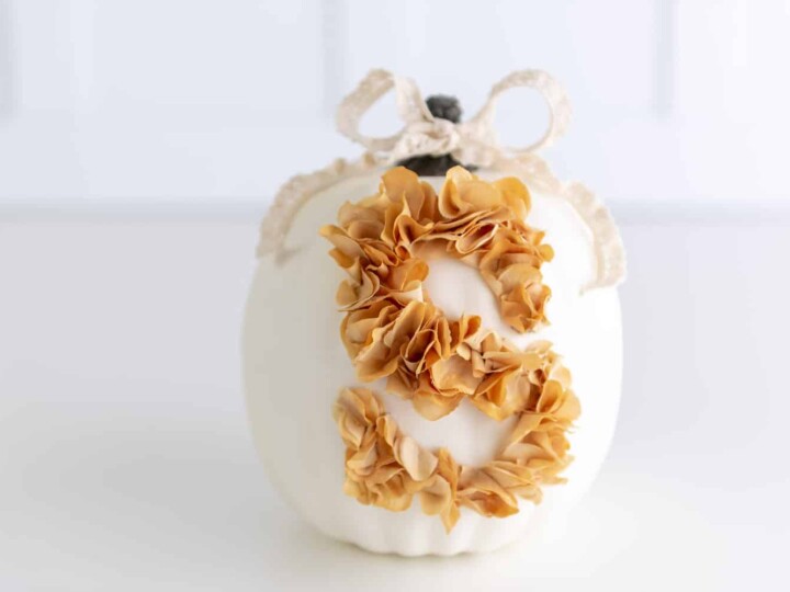 farmhouse white pumpkin with monogram letter made out of flower petals