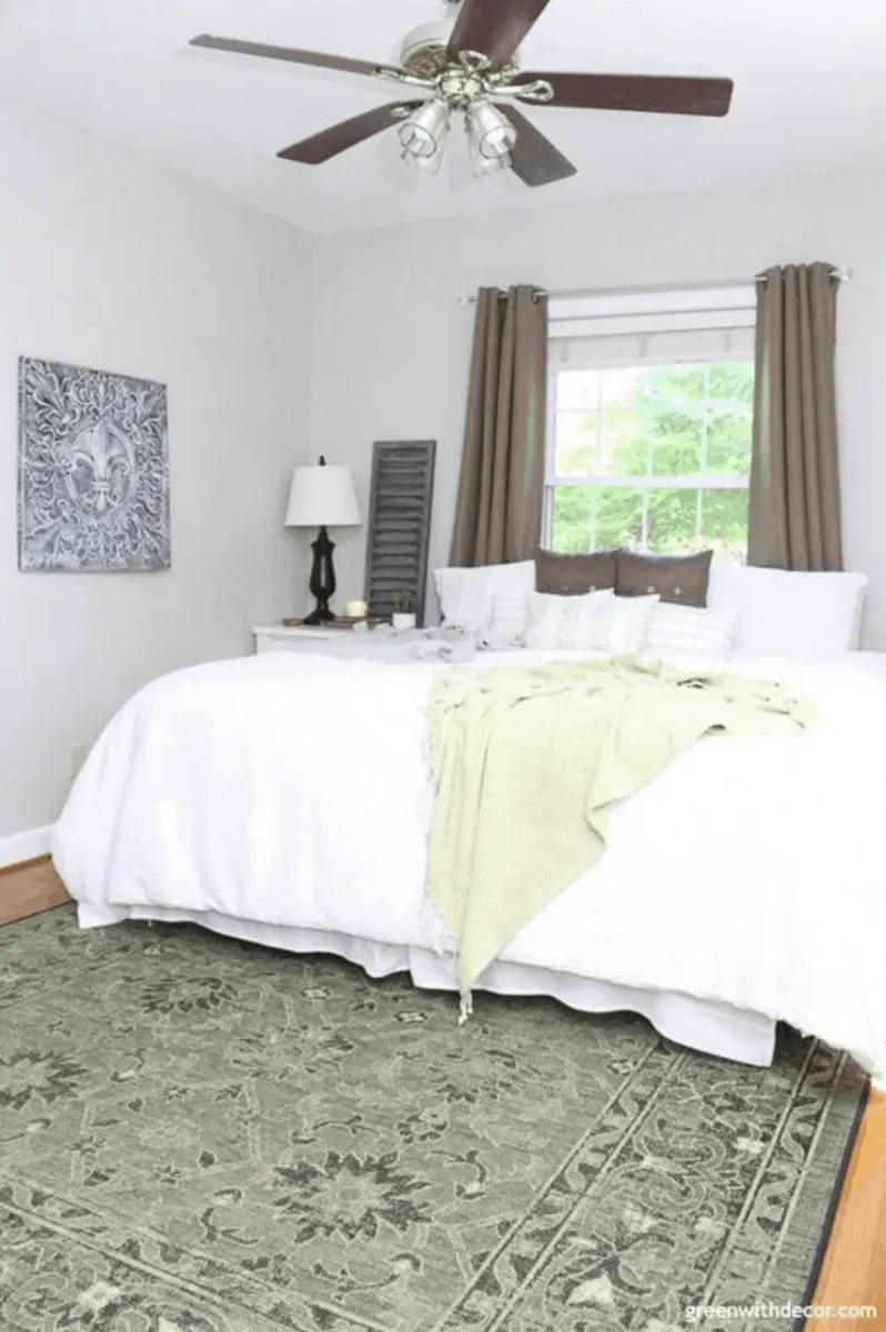 white duvet cover on king size bed in spare guest bedroom