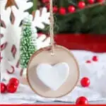 DIY Scandinavian Christmas ornament made of wood and a clay heart