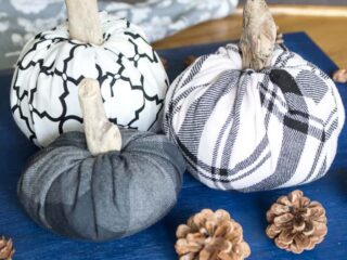 three no-sew fabric pumpkins made from white and grey flannel