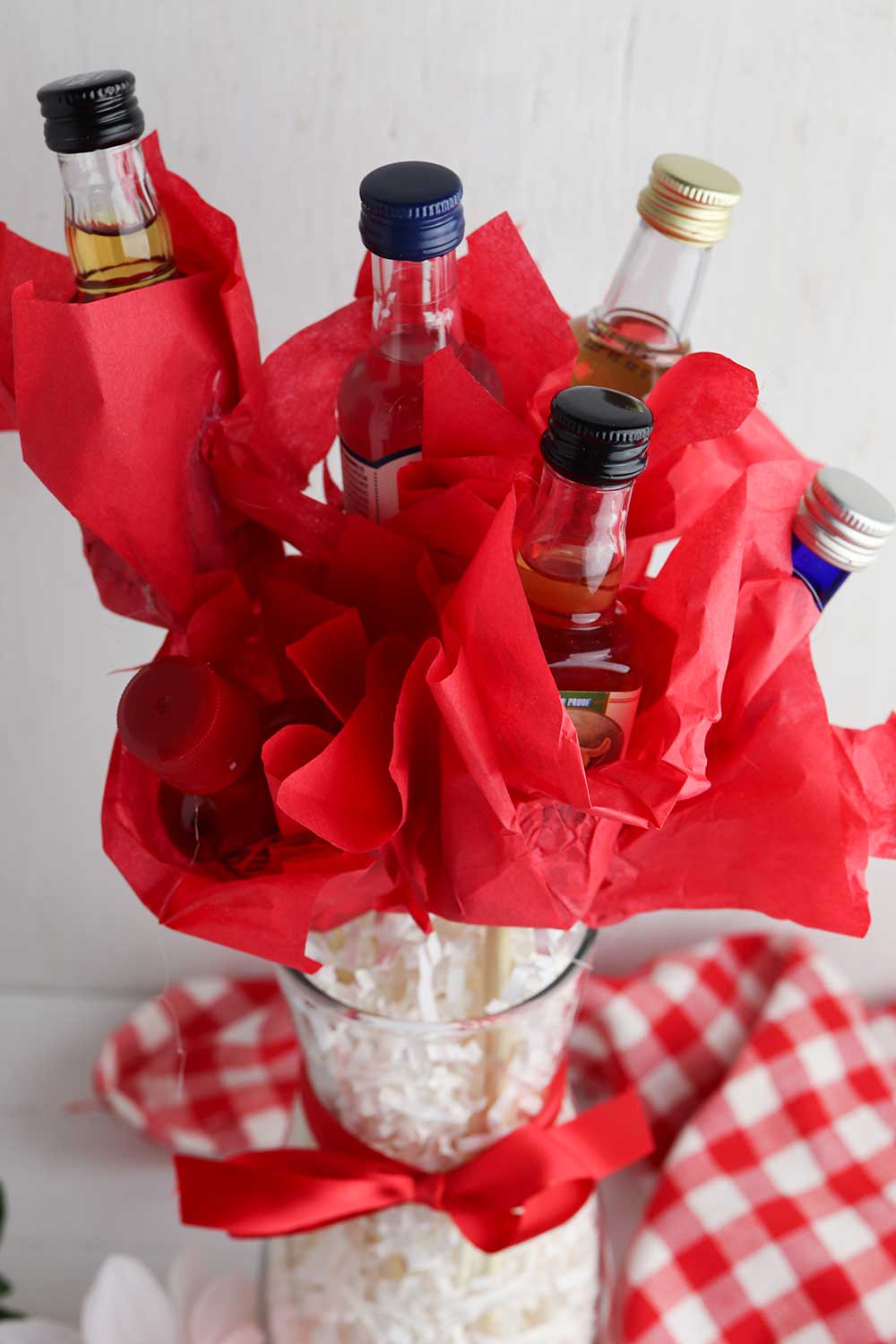 DIY mini liquor bottle bouquet in a vase