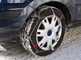 snow chains on a car tire