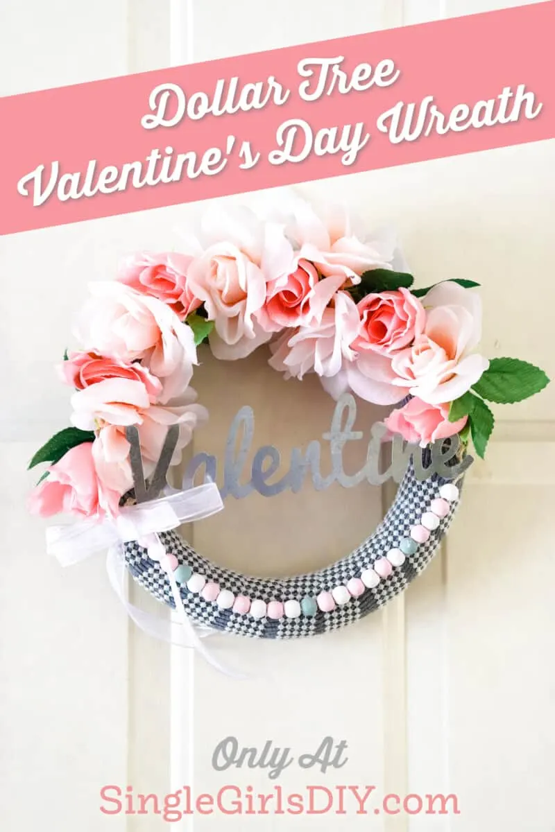 cute valentines day wreath hangin on white front door