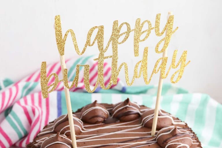gold glitter cake topper with fancy font