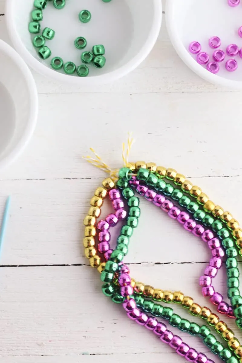 How to Make a Mardi Gras Beads Necklace with Three Strands - Single Girl's  DIY