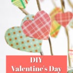 hearts cut out of scrapbook paper glued to branches