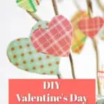 hearts cut out of scrapbook paper glued to branches