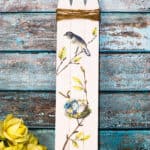 cute picket fence sign against a weathered blue wood background