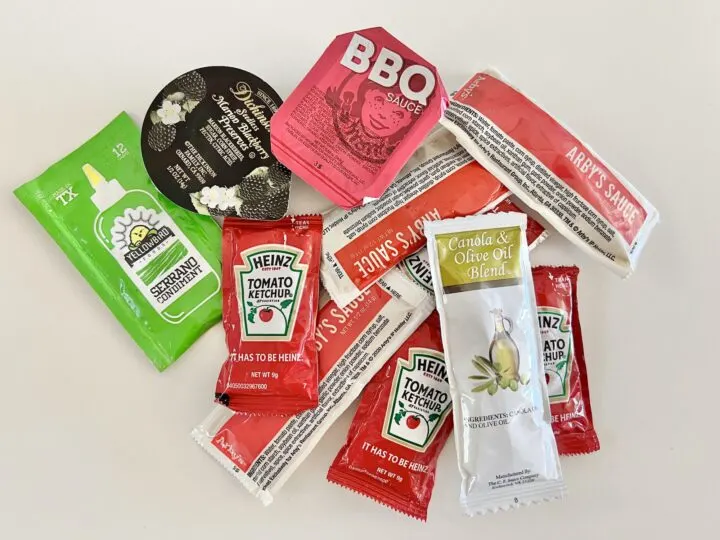packs of condiments on white background