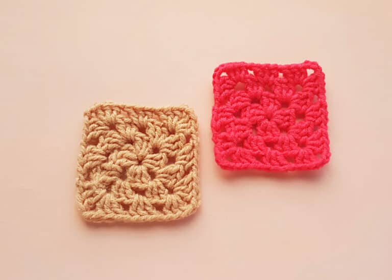 two crocheted granny squares on peach colored background