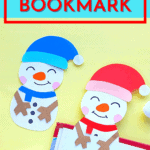 handmade snowman bookmarks displayed on a book against a yellow background