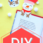 diy snowman bookmarks on a book page against yellow background