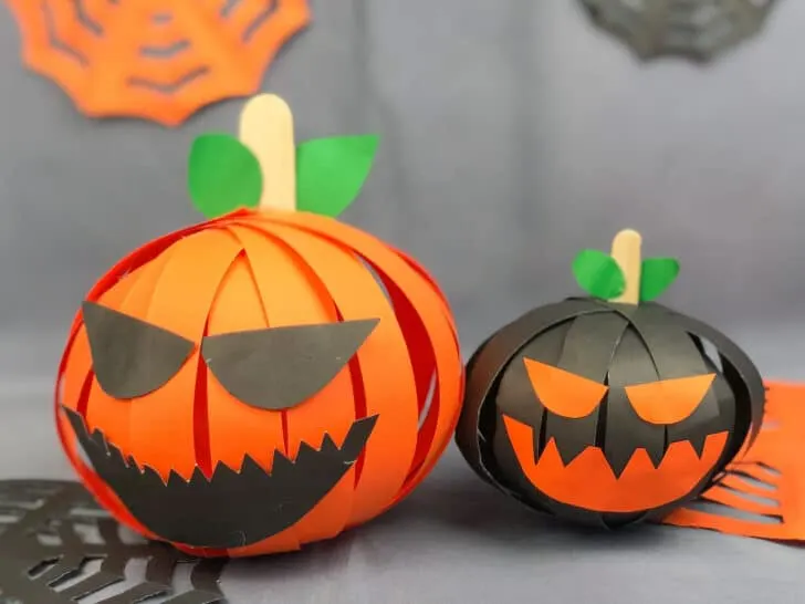 paper strip pumpkins with jack o lantern faces