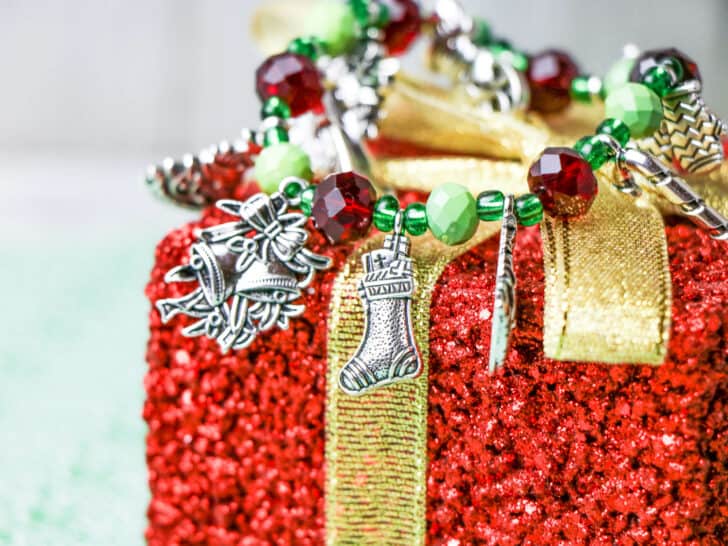 handmade Christmas charm bracelet on sparkly red present ornament