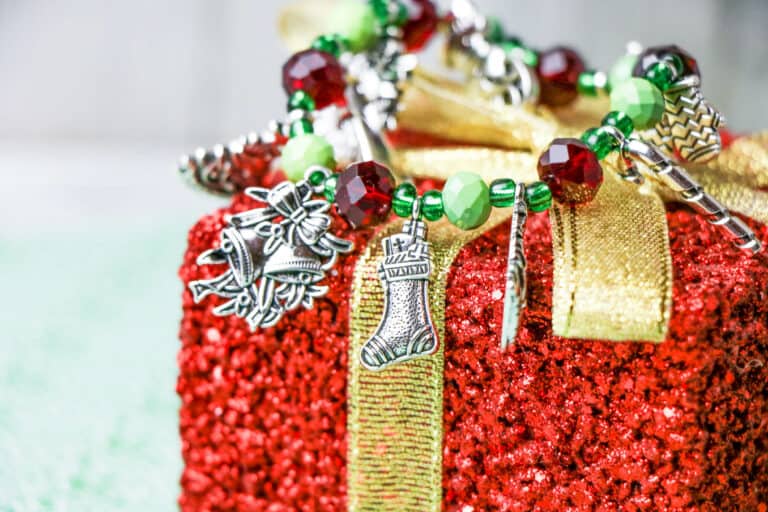 handmade Christmas charm bracelet on sparkly red present ornament