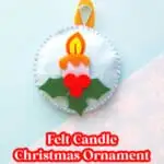 blue handmade Christmas candle ornament on snowflake background