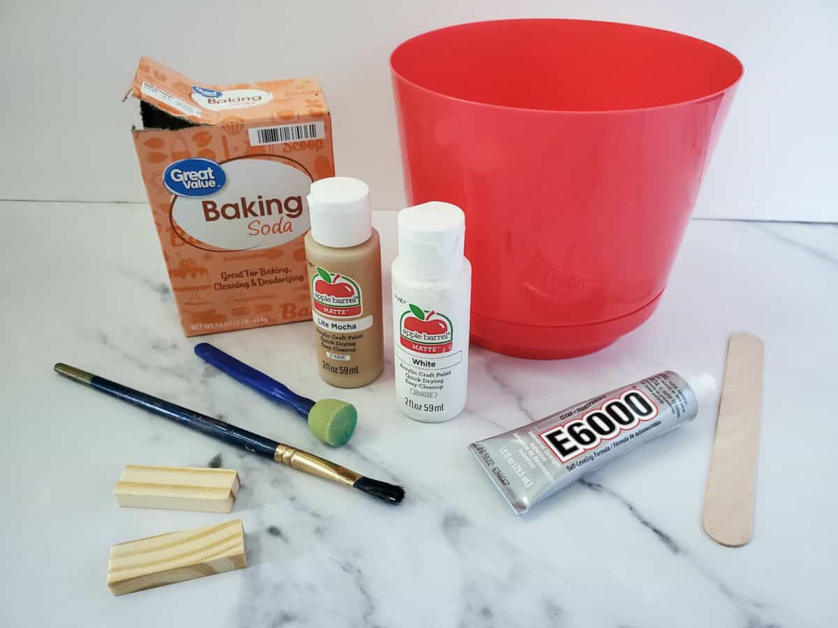 Supplies for Faux Terra Cotta Pot placed on white marble counter top