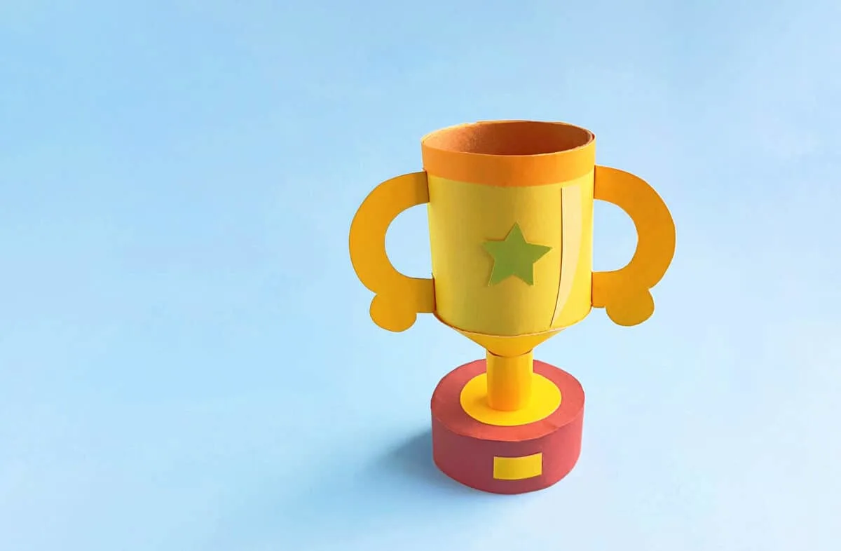 doy trophy made with construction paper displayed with blue background in back