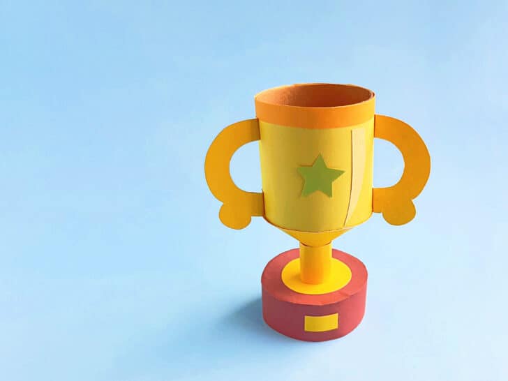 doy trophy made with construction paper displayed with blue background in back