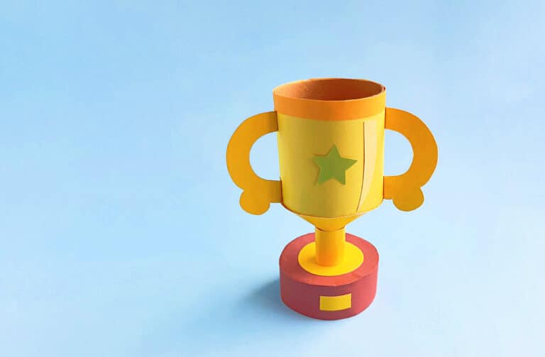 doy trophy made with construction paper displayed with blue background in back