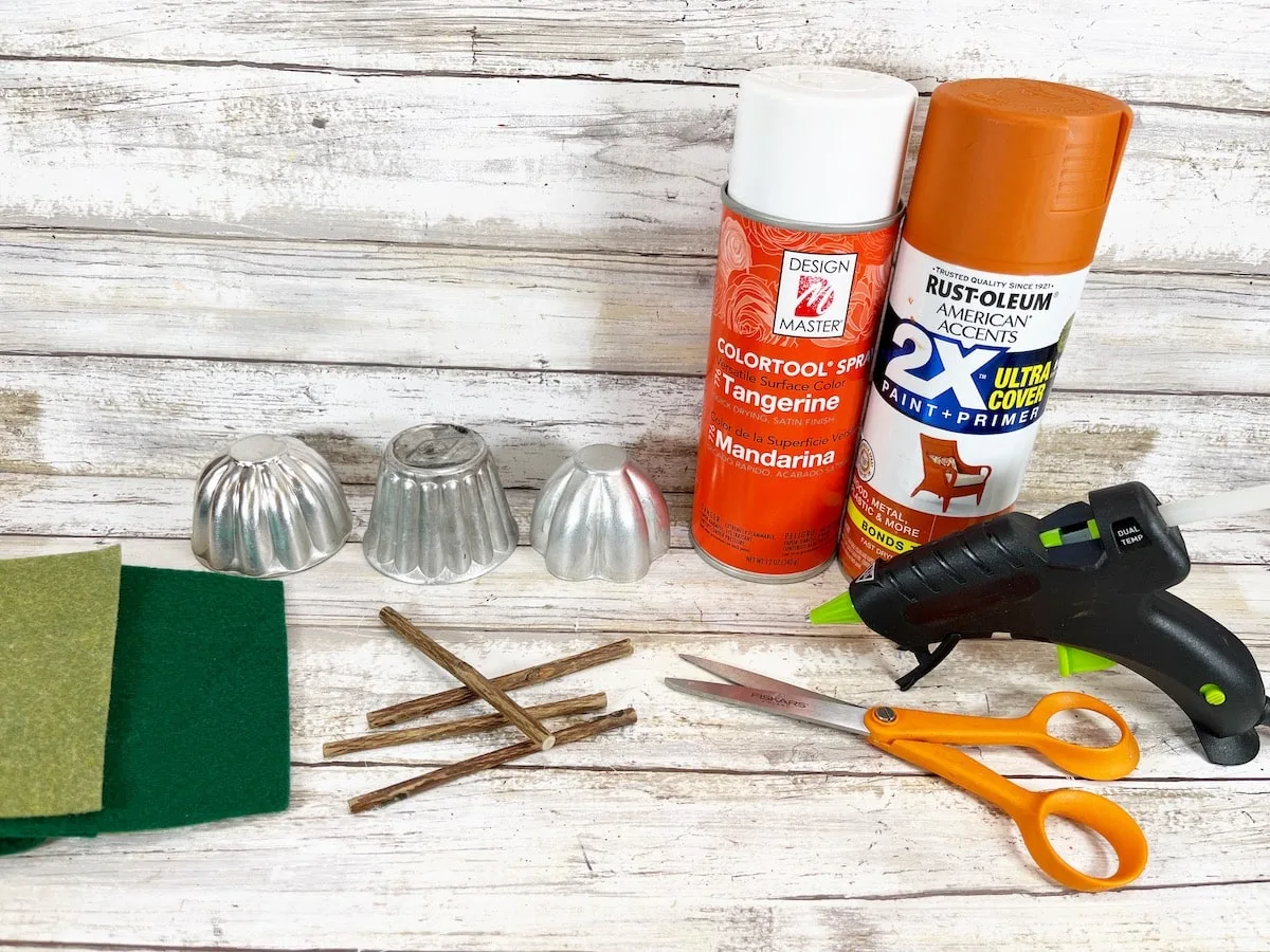 Tin Mold Pumpkins Materials on white wood background