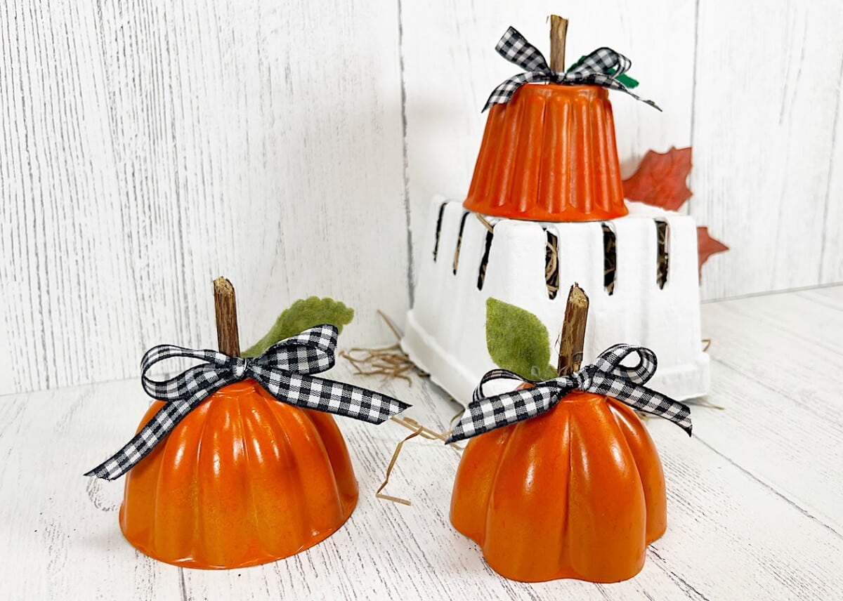 Tin Mold Pumpkins on White Upside down Strawberry Crate
