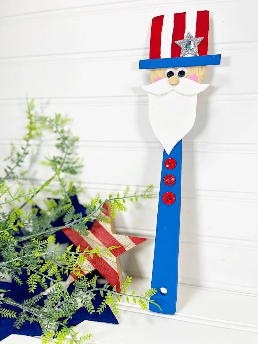 Wooden Spoon Uncle Sam Craft on Wood Wall with red stripped star