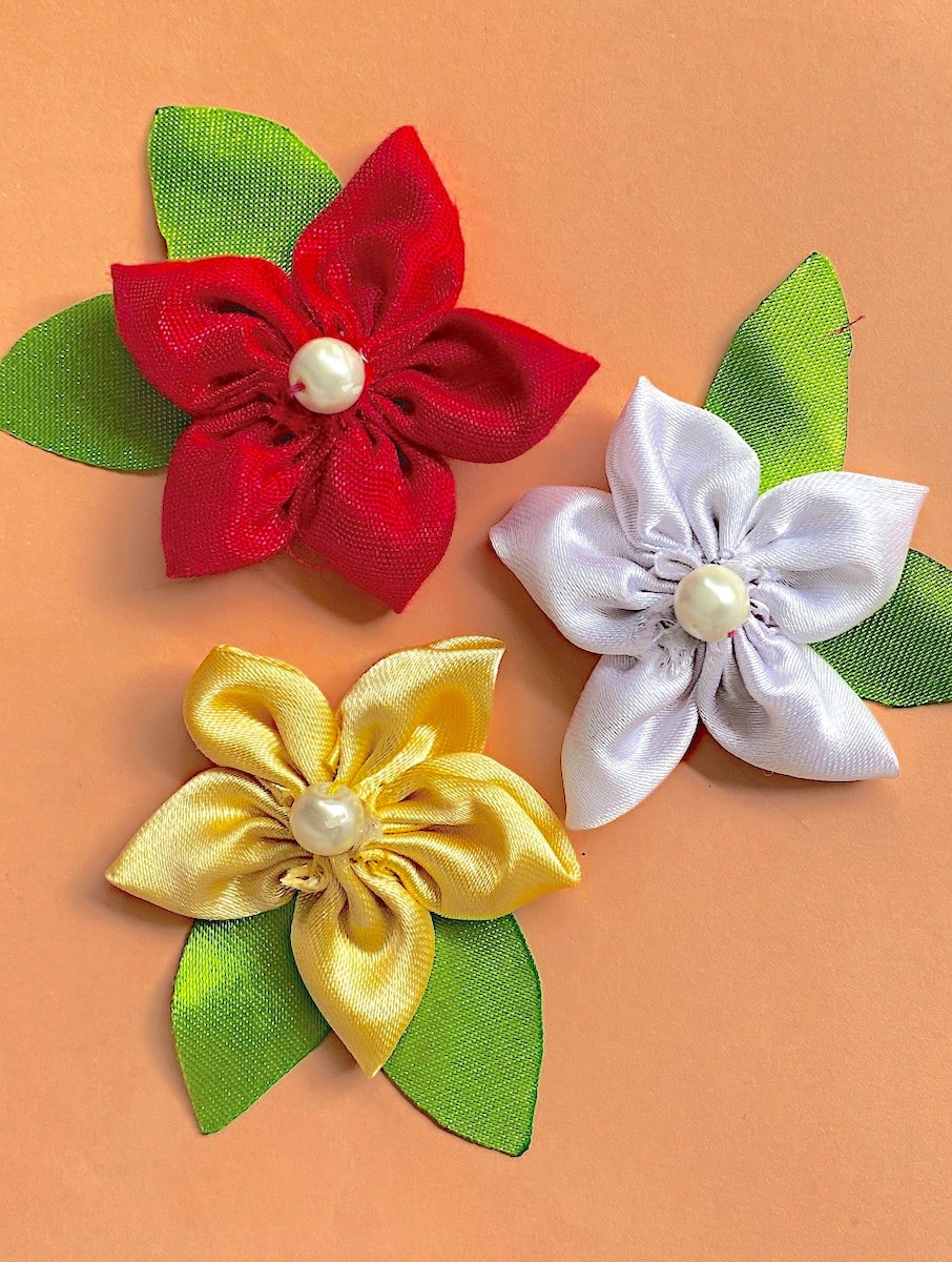 DIY Satin Flowers Red White and Gold on a Tan Background