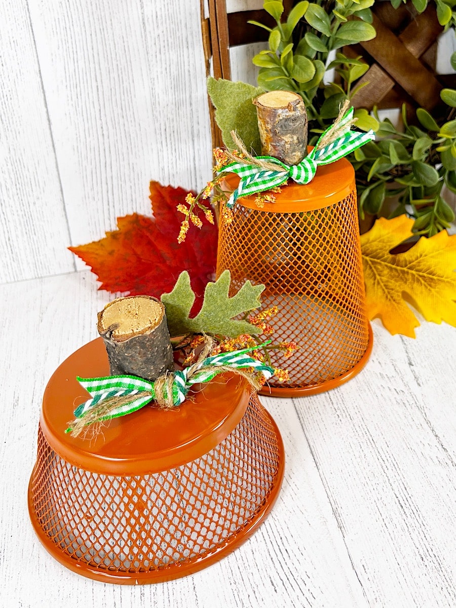 Pencil Cup Pumpkin With Green Ribbon on White Wood Table
