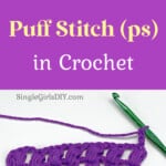 purple yarn and a green crochet hook working a puff stitch against a white background