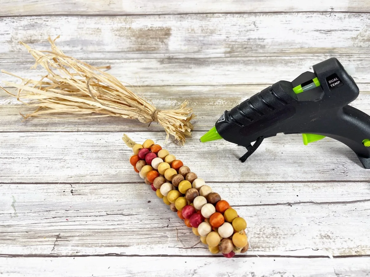 Bead Corn Step 10 on a wood background