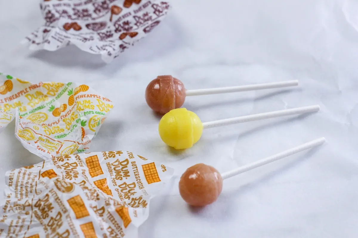 Candy Nativity Step 2 Lollipops are sitting on top of a piece of paper.