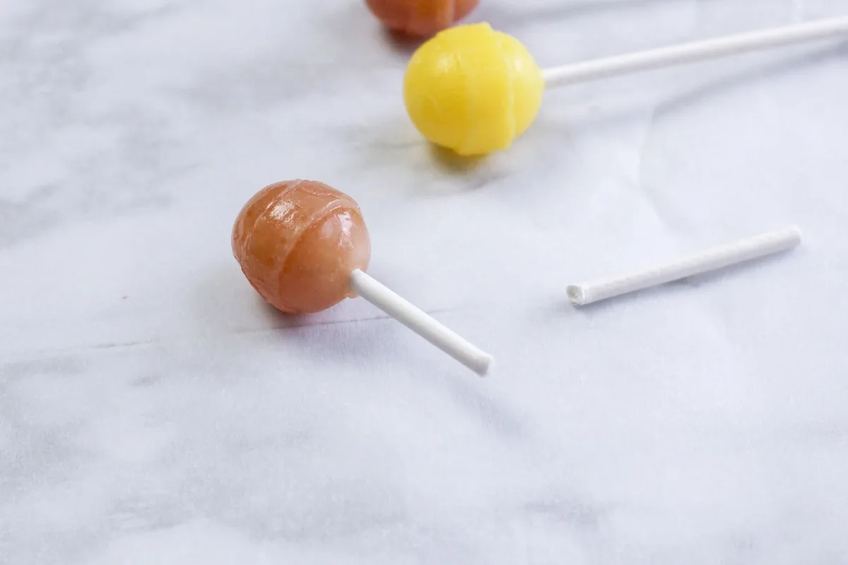 Candy Nativity Step 3 Three different kinds of lollipops on a marble table.