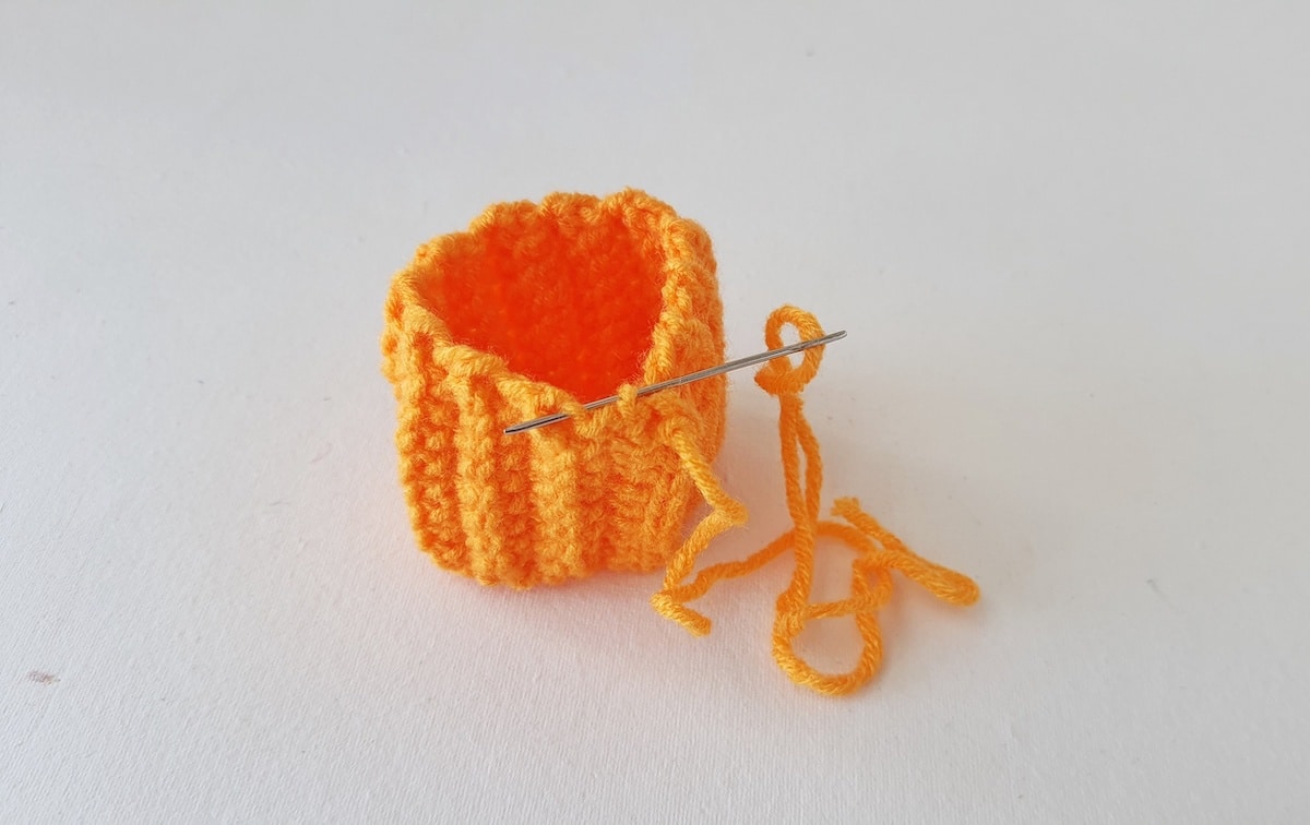 Crochet Pumpkin Step 13 against a white background