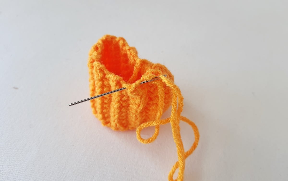 Crochet Pumpkin Step 14 against a white background