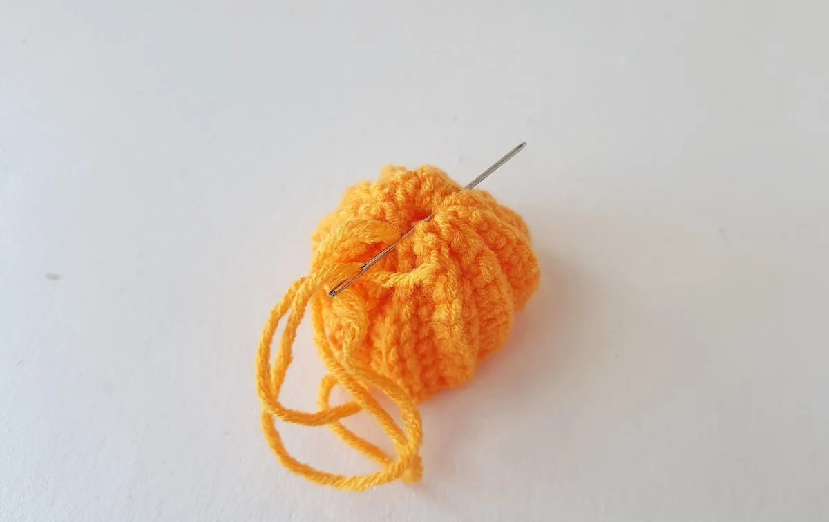 Crochet Pumpkin Step 16 against a white background